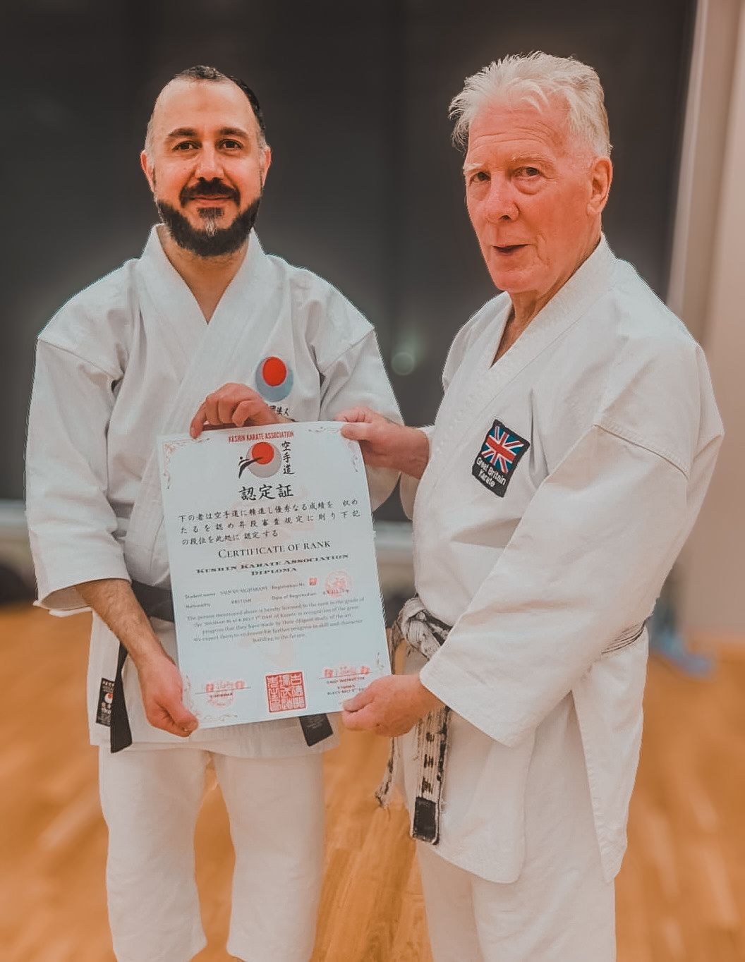 Sensei Sal is awarded his shodan certificate by Sensei Fawcett
